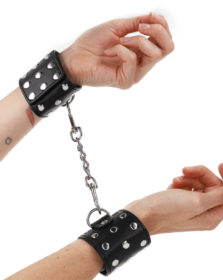 KINK - WRIST RESTRAINTS WITH SNAP FASTEN FULL OF RIVETS BLACK ADJUSTABLE 19-24 CM X 5.5 CM